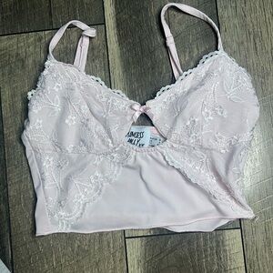 pale pink, front-laced crop top with a bow,